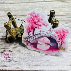 Samolepka s motivem mostu přes řeku obklopeného kvetoucími stromy. Dodá tvému plánování jemnost, krásu a nádech jara.