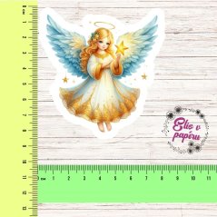 Samolepka s jemným andílkem, držícím zářící zlatou hvězdu, obklopená nebeskými tóny a vánoční atmosférou.